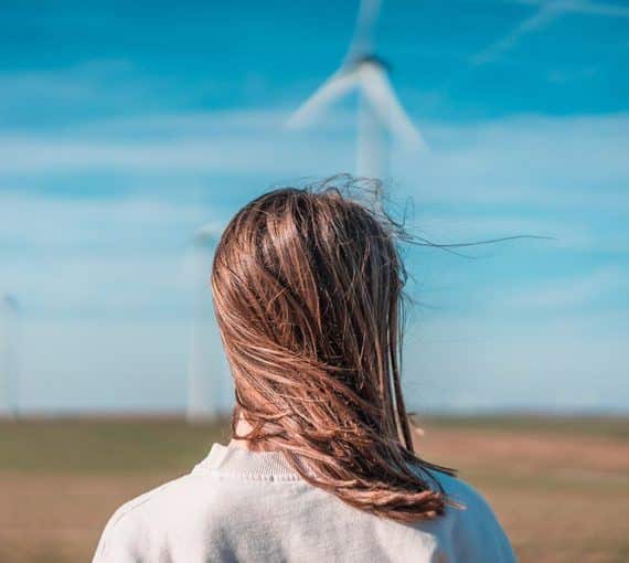 Young woman wind turbine