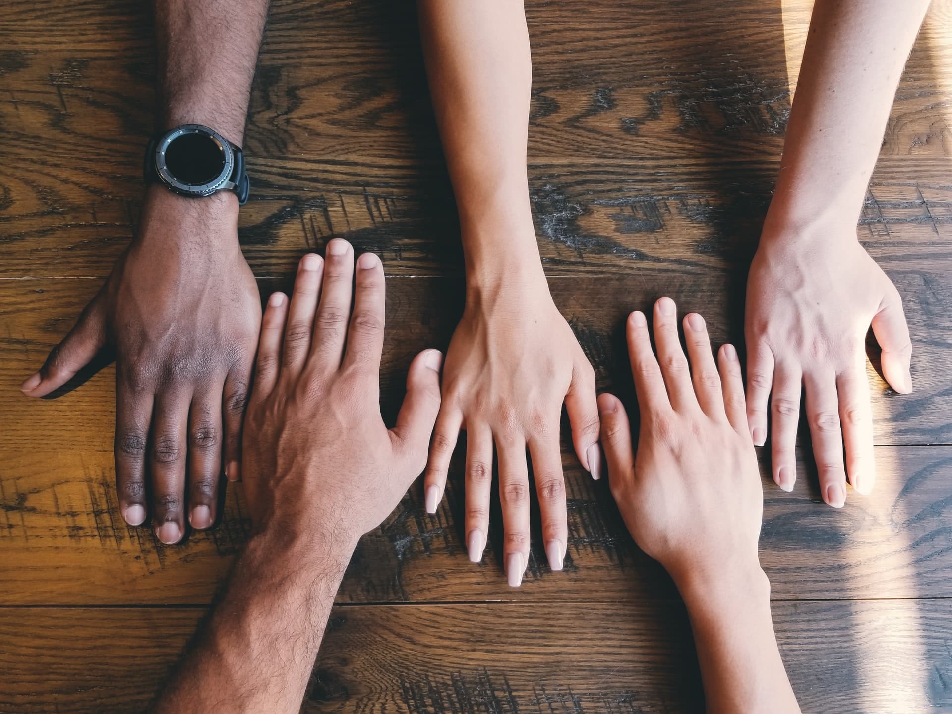 diverse-hands-joined-together